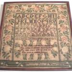 Lovely Massachusetts Sampler with wide floral border worked by Louisa S Webber